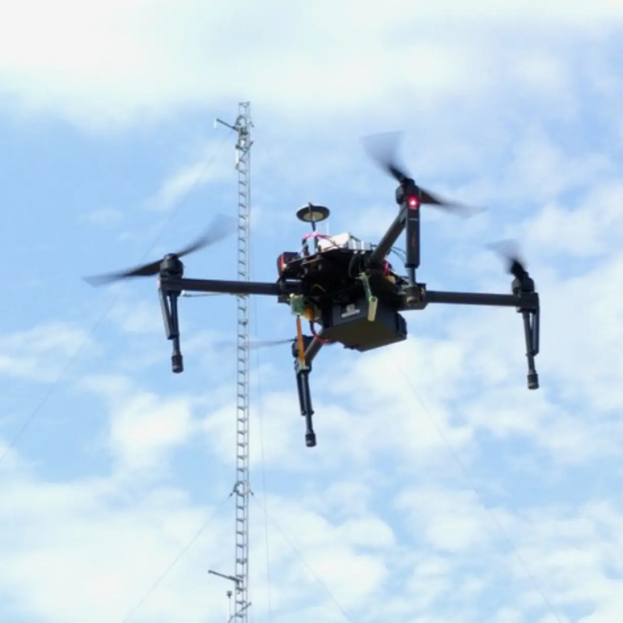 Picture of a drone flying with a Sparvio system mounted on.